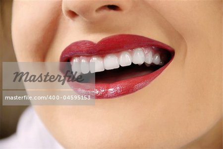 woman with white teeth and red lips laughing