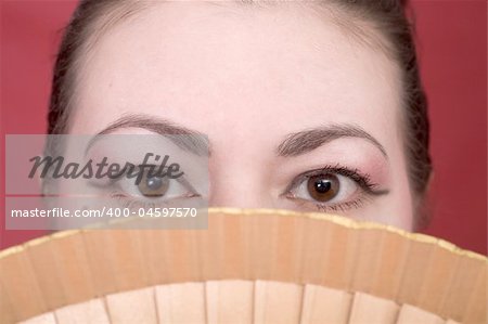 Portrait japanese girl with fan close up