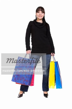 happy brunette woman with shoping bags. over white background
