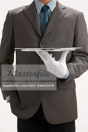 asale person holding a  sliver empty tray