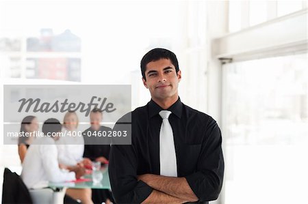 Serious Looking Businessman with arms Folded