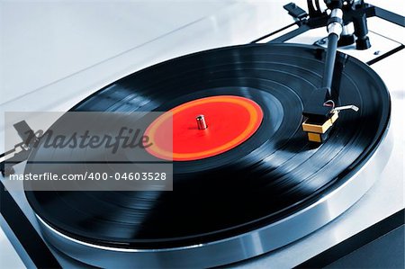 Vinyl record spinning on turntable close up