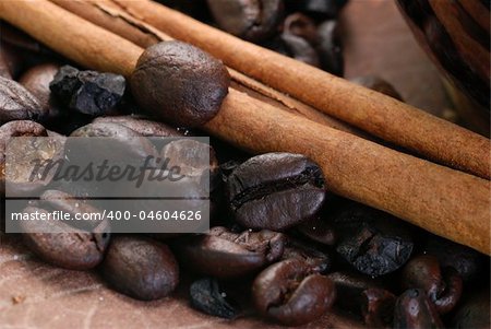 Close up of a mug with a coffee beans