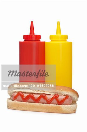 A hot dog with ketchup and mustard bottles isolated on white background