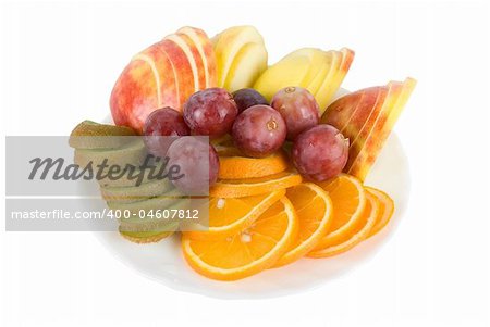 Colorful fruit salad with orange, kiwi, grapes and apple