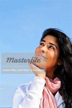 Portrait of beautiful smiling girl looking up