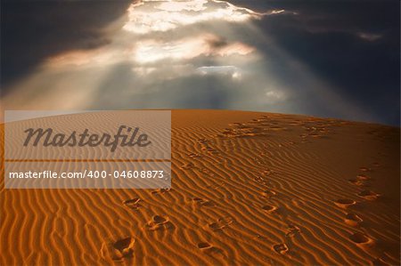 the sky split over the desert sand,  Erg Chebbi, Morocco