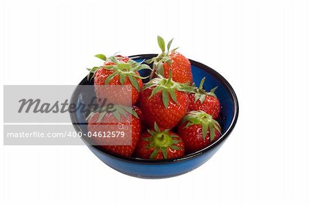 blue bowl with delicious red strawberries