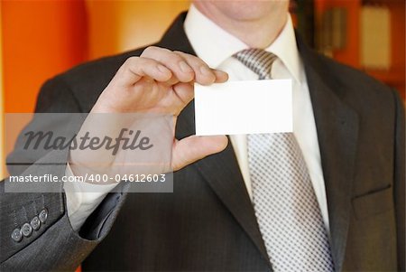 businessman hand holding and showing blank business card