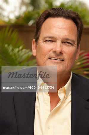 Handsome Male Portrait with Sportcoat in the Outdoors.