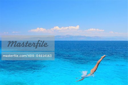 Beautiful young woman enjoying the Ionian sea in Greece