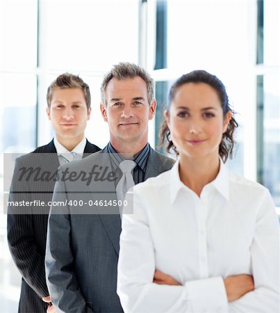 Senior businessman in a row with his business team