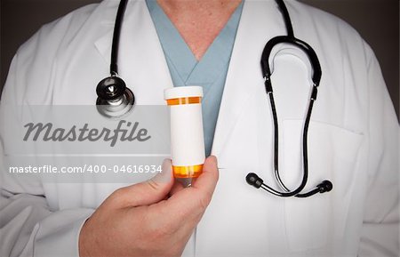Male Doctor with Stethoscope and Blank Medicine Bottle.