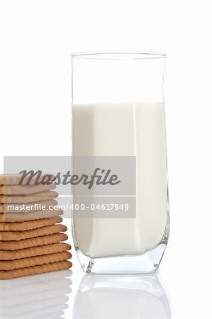 A stack of cookies and fresh milk tumbler. Shallow depth of field