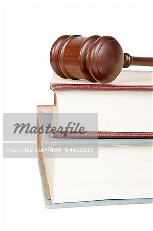 Wooden gavel from the court and law books isolated on white background. Shallow depth of field