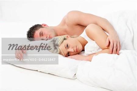 Young couple relaxing in bed