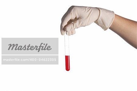 hand in a rubber glove holds a test tube with a liquid