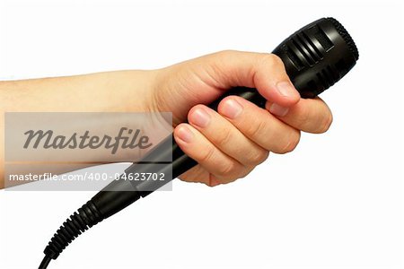 Black microphone in the hand isolated over white background