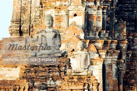 Buddha statues at the ruins of the Buddhist temple of Wat Chai Wattanaram in Ayutthaya near Bangkok, Thailand.