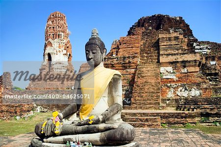 Seated Buddha statue at the temple of Wat Mahatat in Ayutthaya near Bangkok, Thailand.