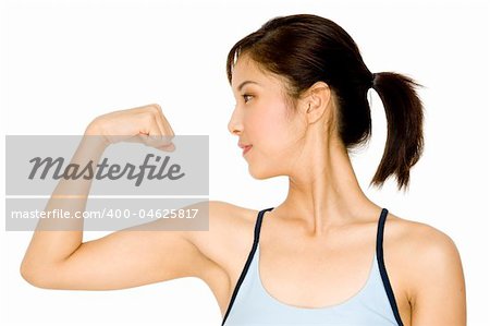 A pretty young asian woman flexing her arm
