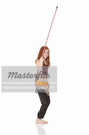 Young Caucasian belly dancing girl in beautiful decorated clothes on white background and reflective floor. Not isolated