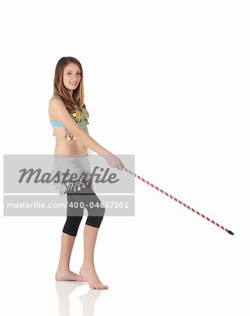 Young Caucasian belly dancing girl in beautiful decorated clothes on white background and reflective floor. Not isolated