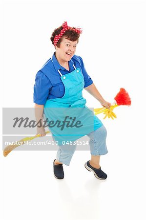 Happy, smiling maid riding her broom like a witch. Full body isolated.