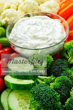 Platter of assorted fresh vegetables with dip