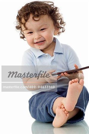Child eats chocolate, isolated on a white background.