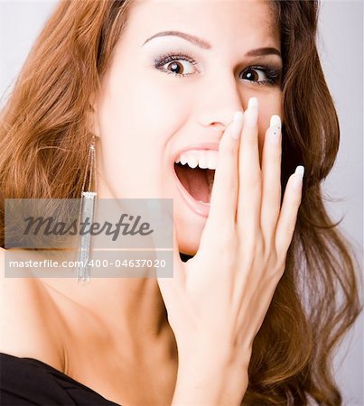 smiling surprised young woman isolated on white