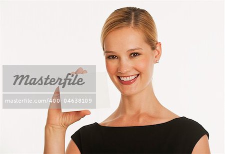 businesswoman holding up blank white card for copy space with white seamless background