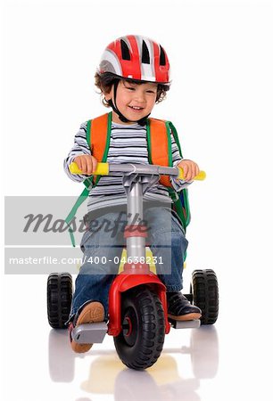 little boy riding bicycle