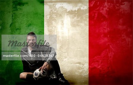 italian soccer player sitting against a italian flag background