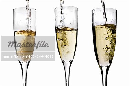 Three glasses of champagne being poured