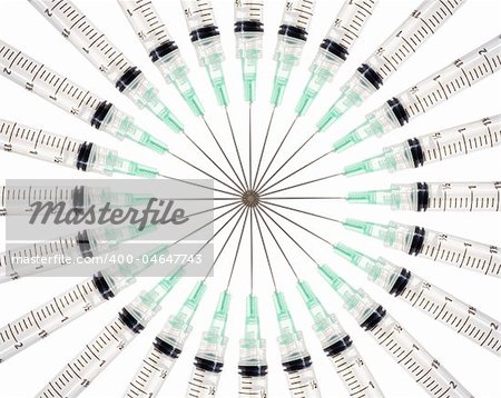 Stock image of symmetrically arranged syringes on a circle, isolated on white