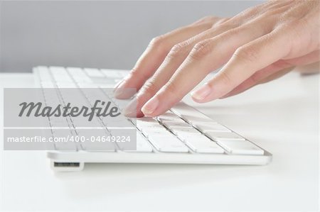woman hands typing keyboard on desktop