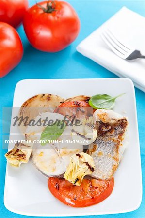 fresh slice of hake baked with vegetables