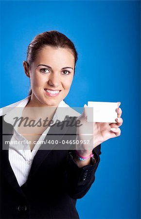 Portrait of a beautiful and young businesswoman holding a business card