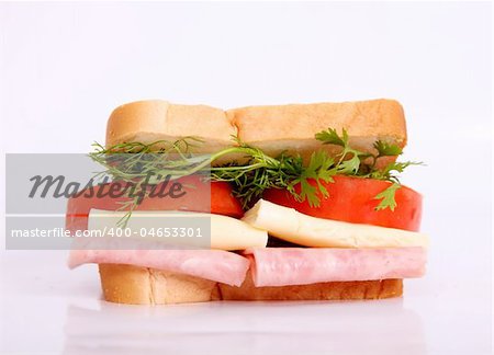 Sandwich with cheese, ham and tomatoes. Food image