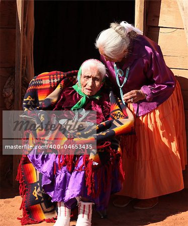 Navajo Family of 2 Women Outdoors in Front of Family Hogan