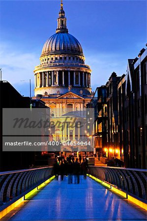 View of St. Paul's Cathedral in London from Millennium Bridge at night