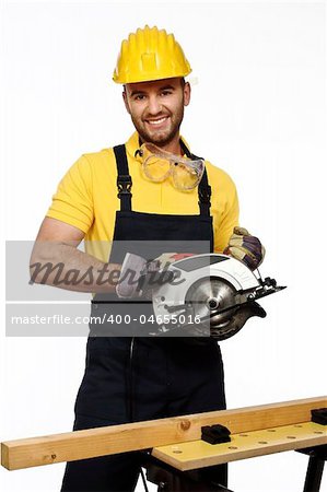 caucasian positive young handyman ready to work isolated on white background