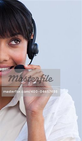 Portrait of a beautiful ethnic young businesswoman working in a call center