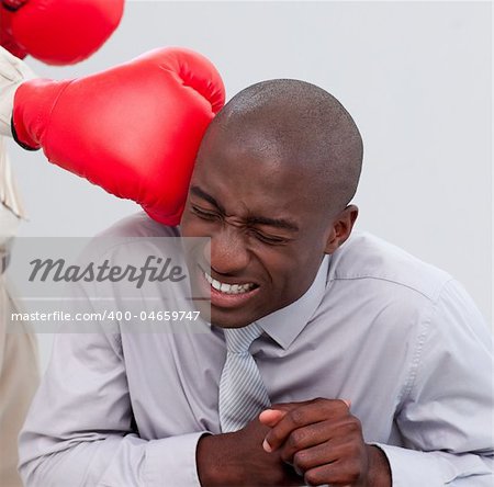 Portrait of an Afro-American businessman being boxed in the office