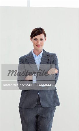 Attractive businesswoman with folded arms isolated on white background