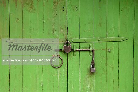 old medieval green gate - locked up