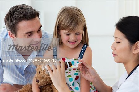 Serious doctor giving medecine to a patient in the hospital