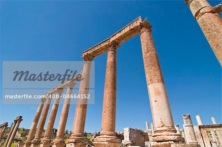 Ancient columns with blue sky in Jerash, Jordan