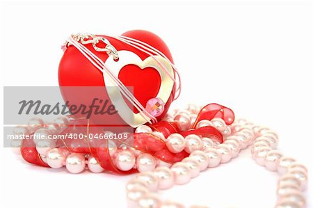 Valentine hearts,red ribbon,pink pearls on white background.